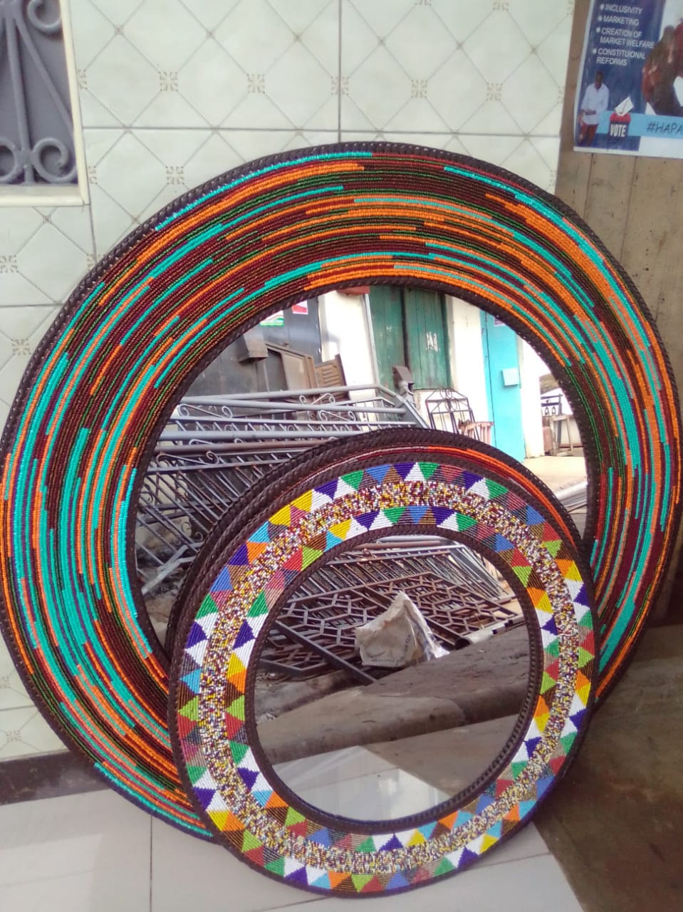 Teal and orange beaded mirror