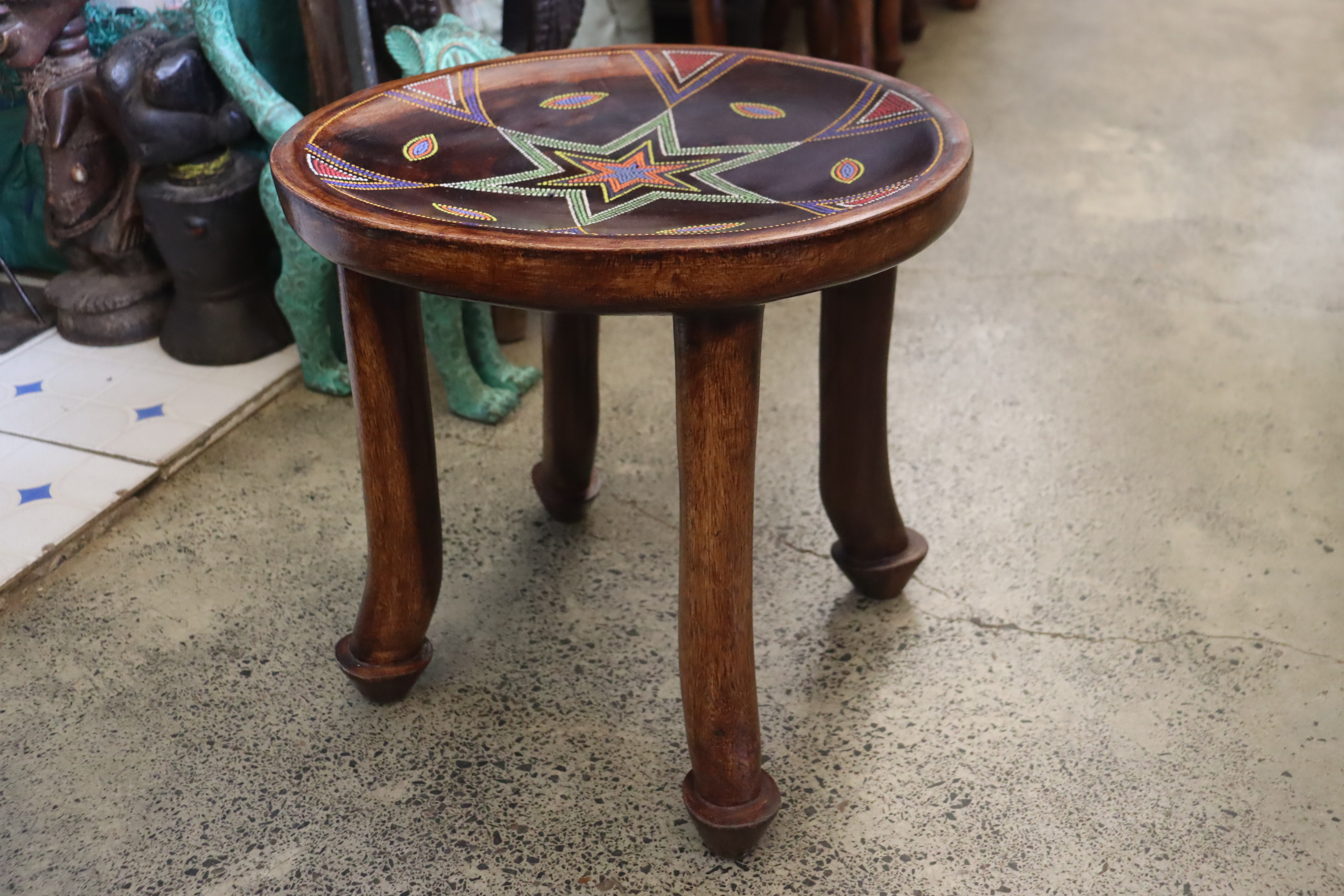 Timeless 4-legged traditional stool with beaded star pattern