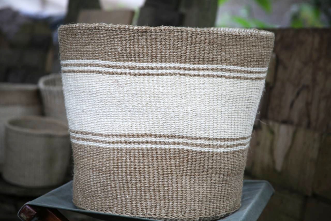 Wide Stripped Kiondo baskets in varied colors with handles