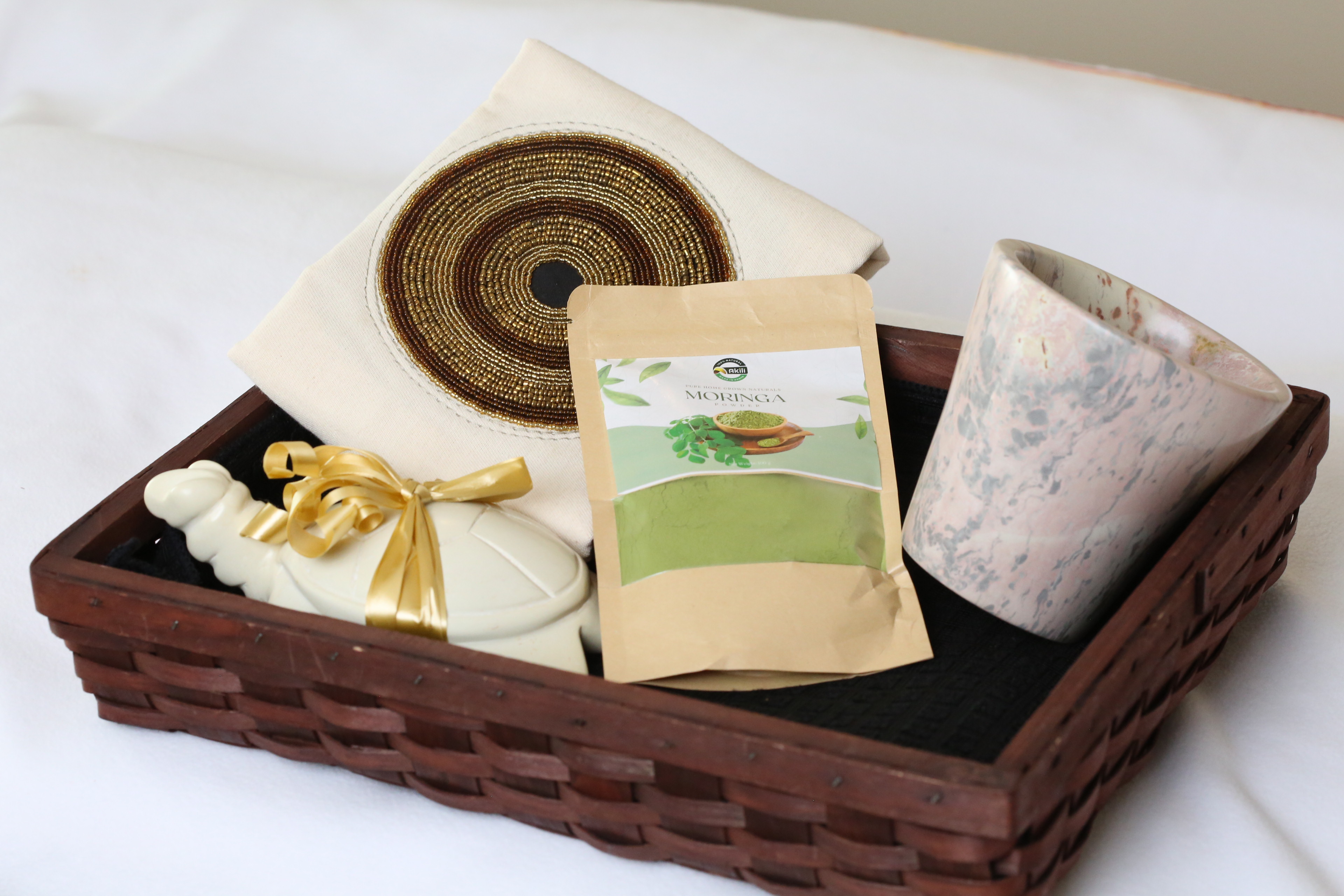 Basket with Soapstone planter, turtle, pillow cover and Moringa seeds package